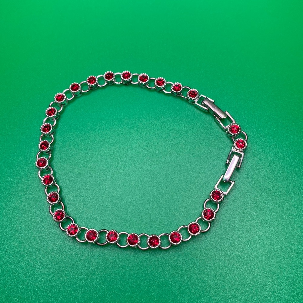 Avon Signed Ruby Red Rhinestone Tennis Style Chain Bracelet Silver Tone